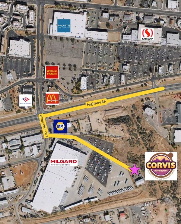 Satellite map of a shopping center with yellow route lines and store logos, including McDonald’s and Corviss.