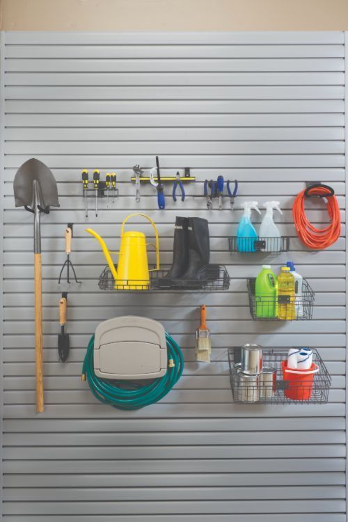 Walk-in closet with light blue cabinets, filled with clothes, shoes, and accessories.