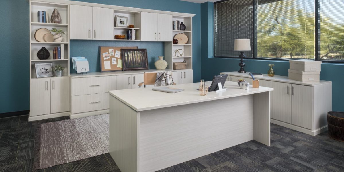 There is a large desk in the middle of the room.