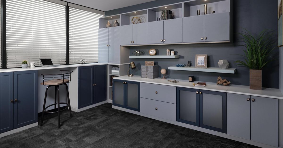 Office with gray and blue cabinets, desk, and large window.