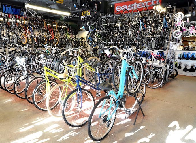A store filled with lots of bicycles and a sign that says eastern