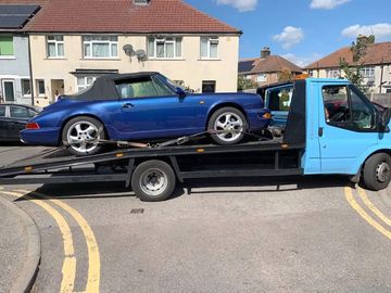 blue car getting towed