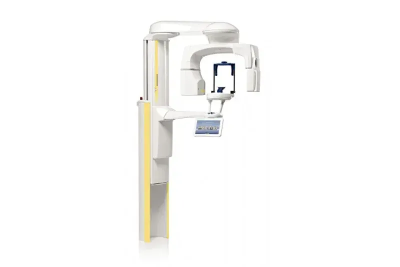 An x-ray machine is sitting on top of a pole on a white background.