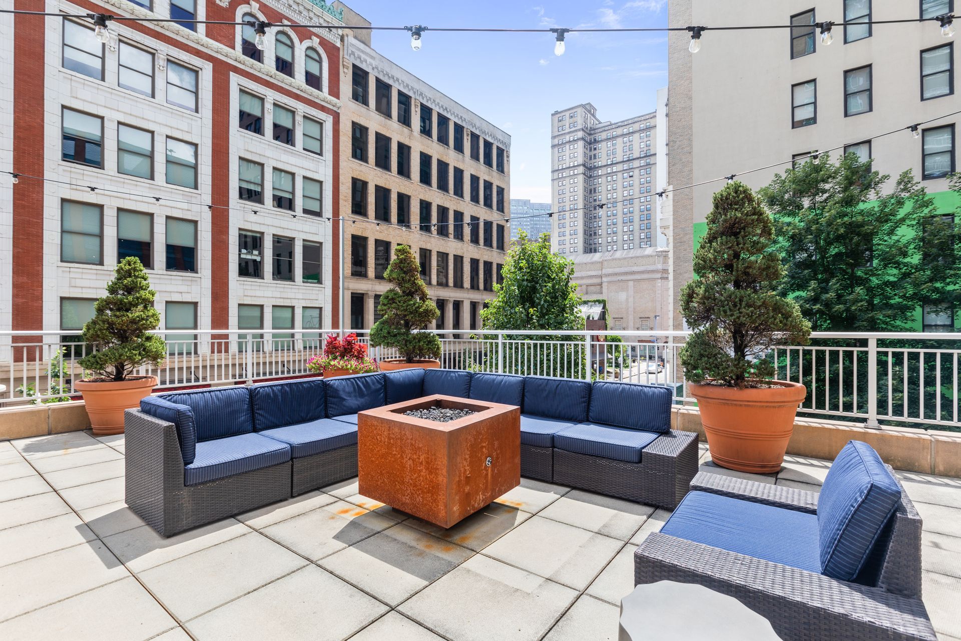 There is a fire pit on the roof of a building.