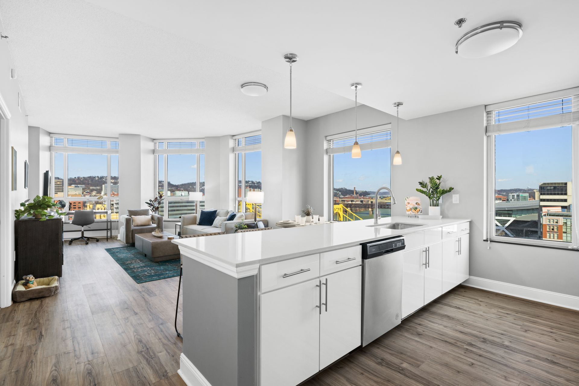 A kitchen with a large island and stainless steel appliances