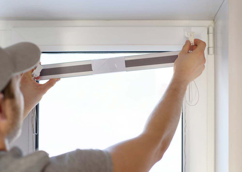 Man Installing Blinds