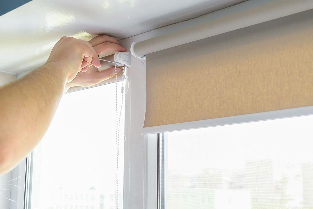 Man Installing Roller Blinds