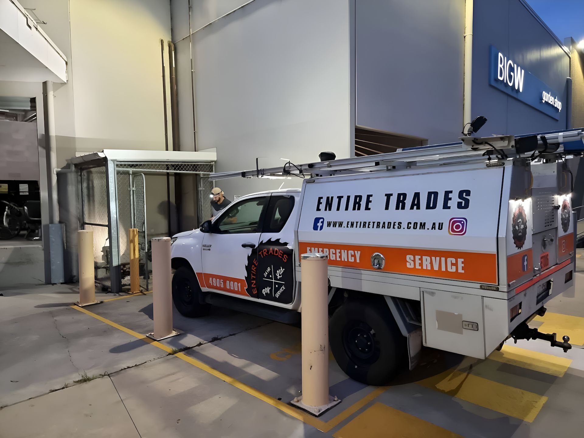A Work Ute Is Parked On Concrete In Front Of A Building— Entire Power Solutions In Wallsend, NSW
