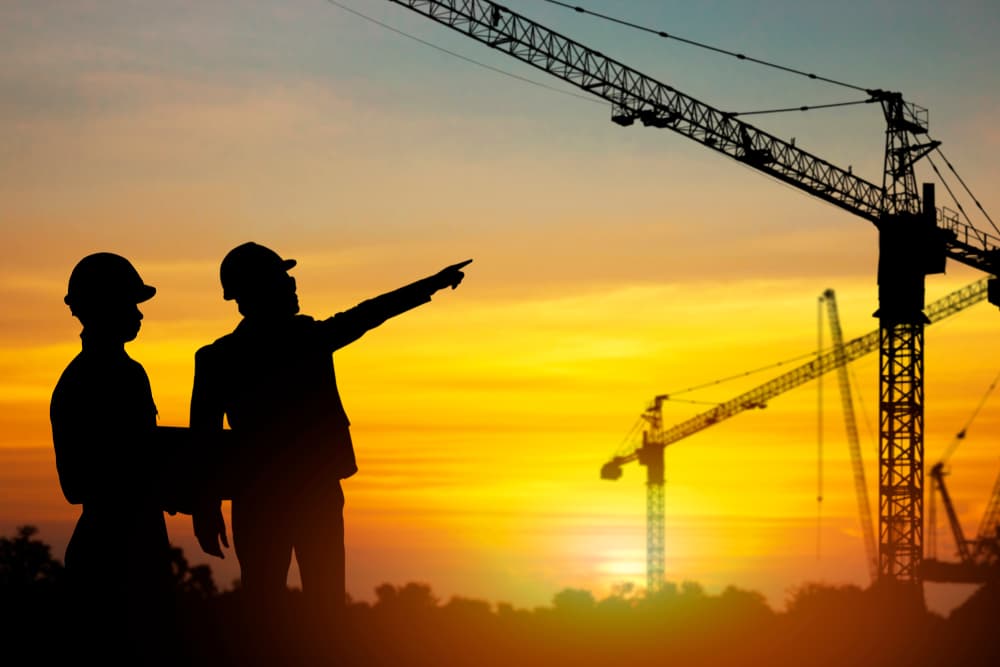 Construction Worker Looking At Crane — Mini Crane Hire In Alstonville, NSW