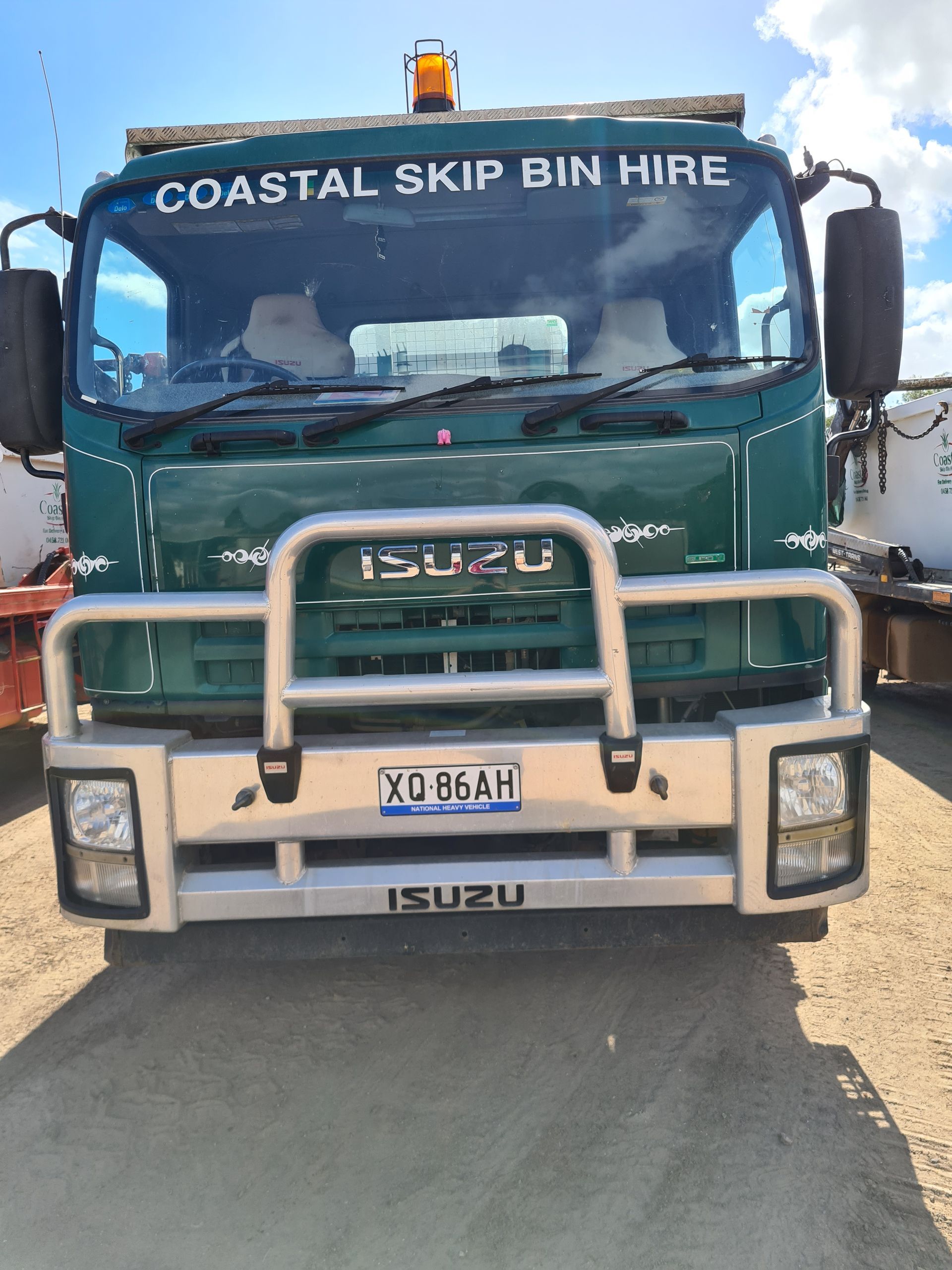 Green Isuzu truck with