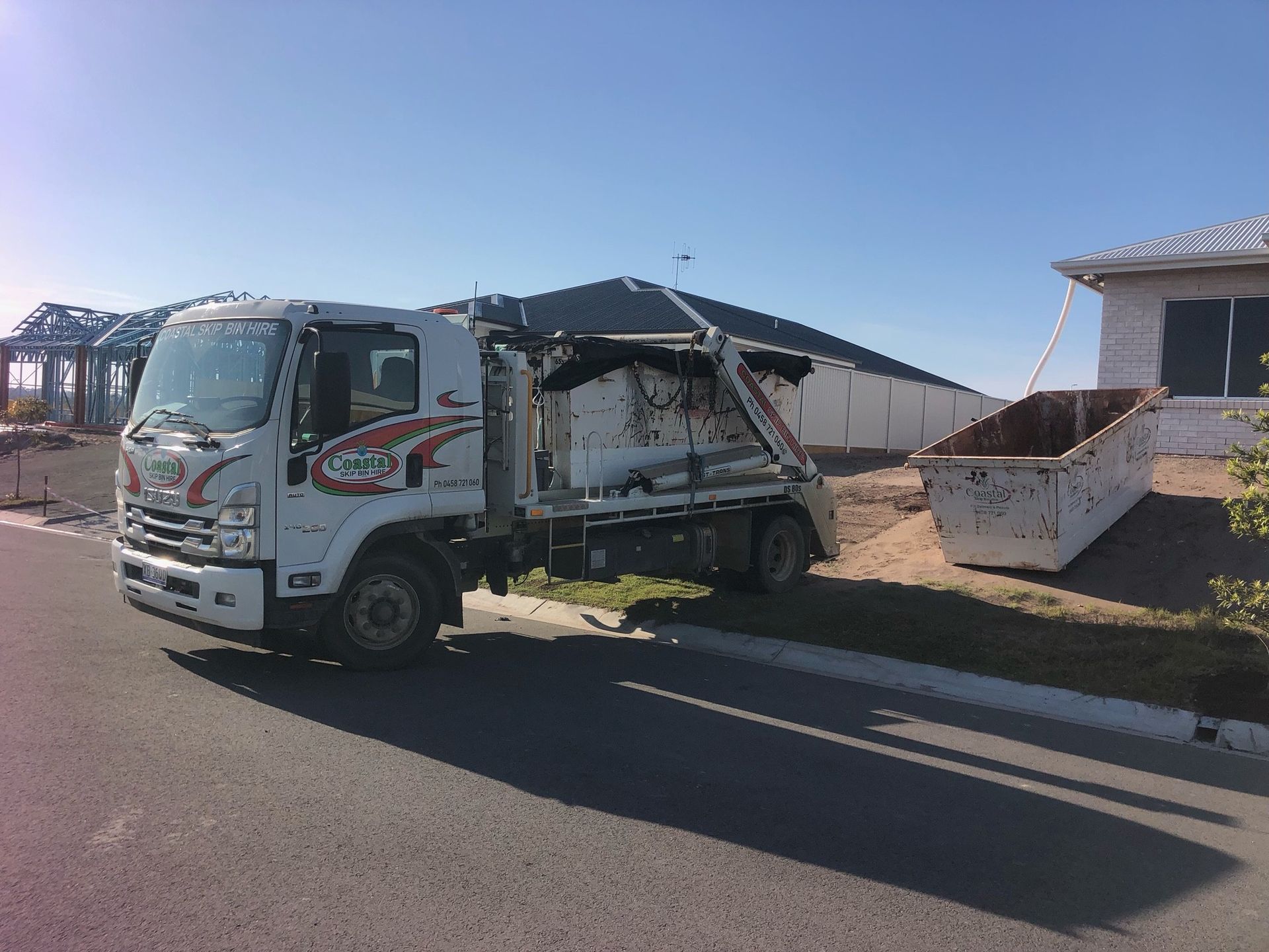 Truck Lifting a Large Waste Container — Coastal Skip Bin Hire In Point Vernon, QLD