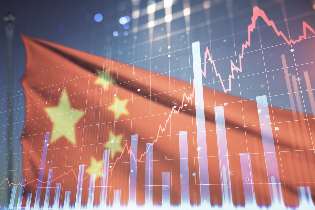 A close up of a chinese flag with a graph in the background.