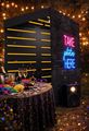 Black booth with neon sign 