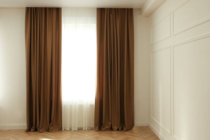 Window with elegant curtains in modern room