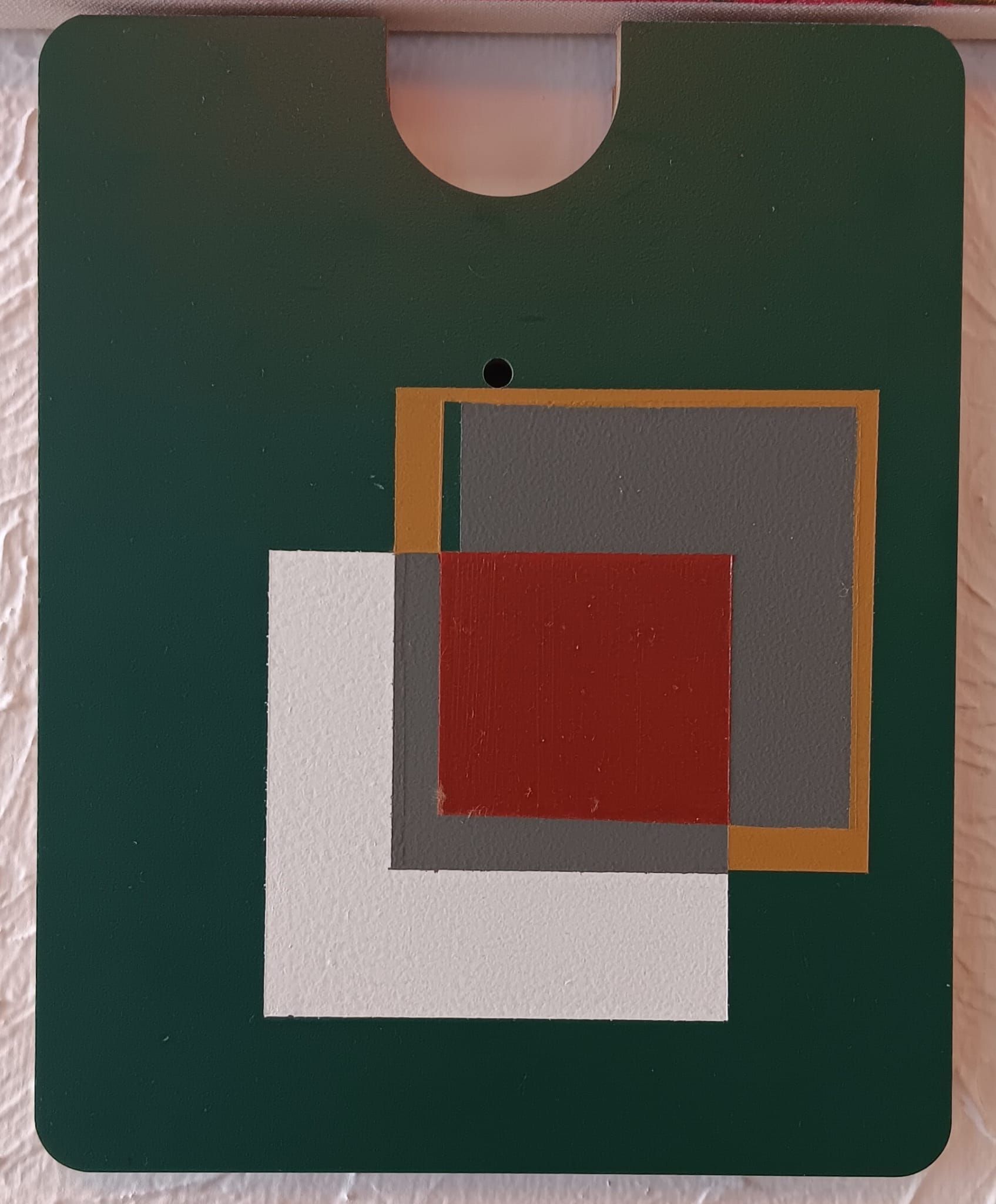 A green piece of paper with squares on it