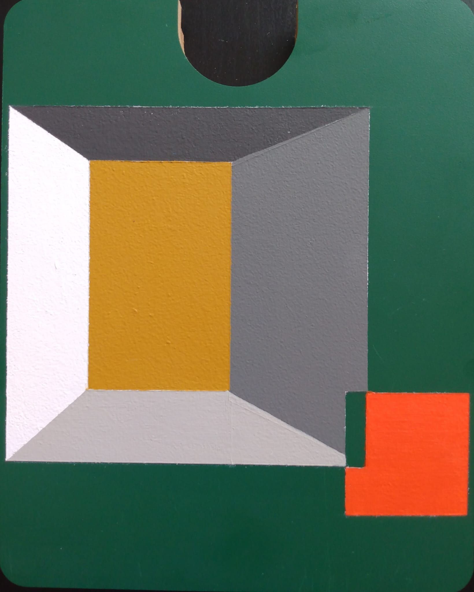 A green square with a yellow square in the middle