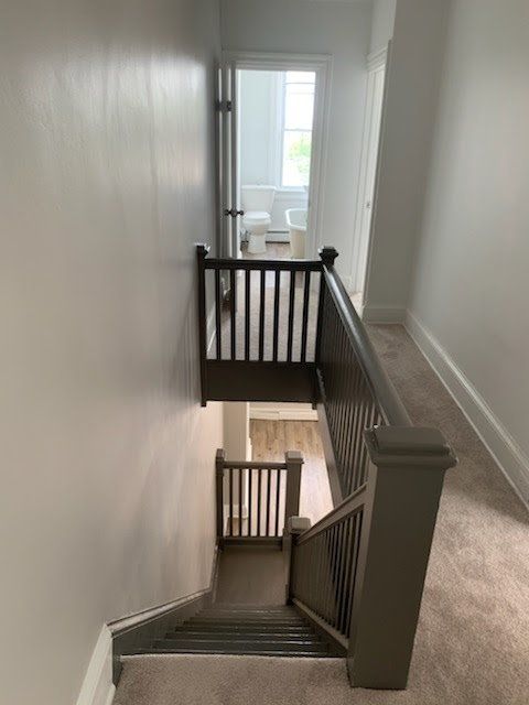 A staircase leading up to a second floor in a house.