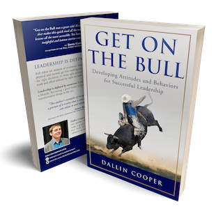 The book cover Get on the Bull by Dallin Cooper, showing a bull rider in action against a light gray and blue background.
