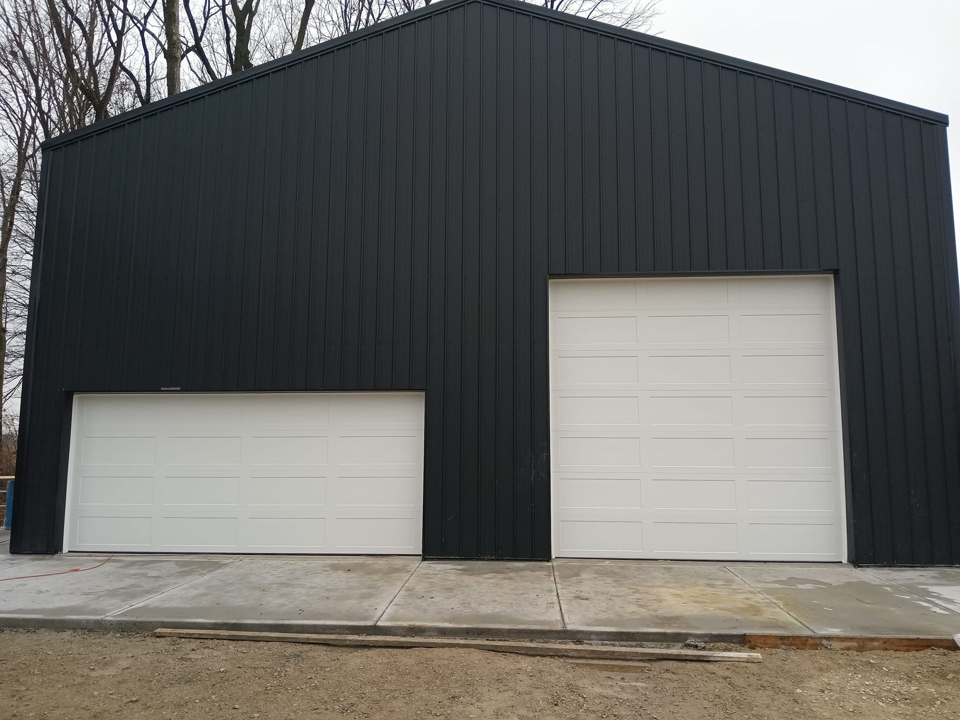 A row of garage doors on the side of a building.