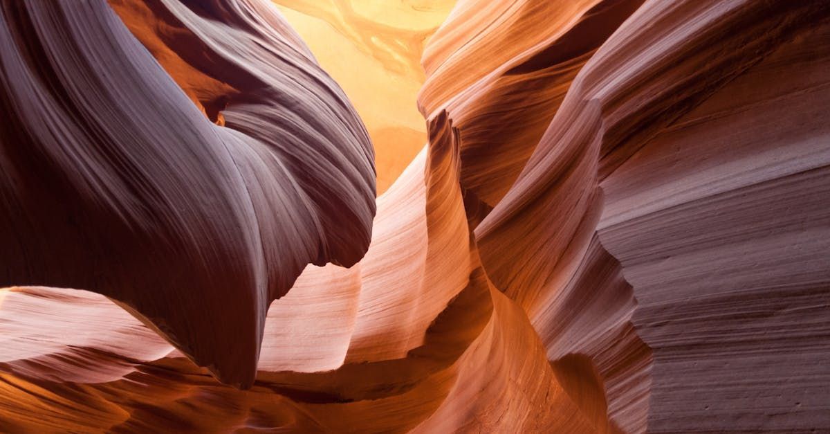 Sandstone canyon walls with orange and brown hues.