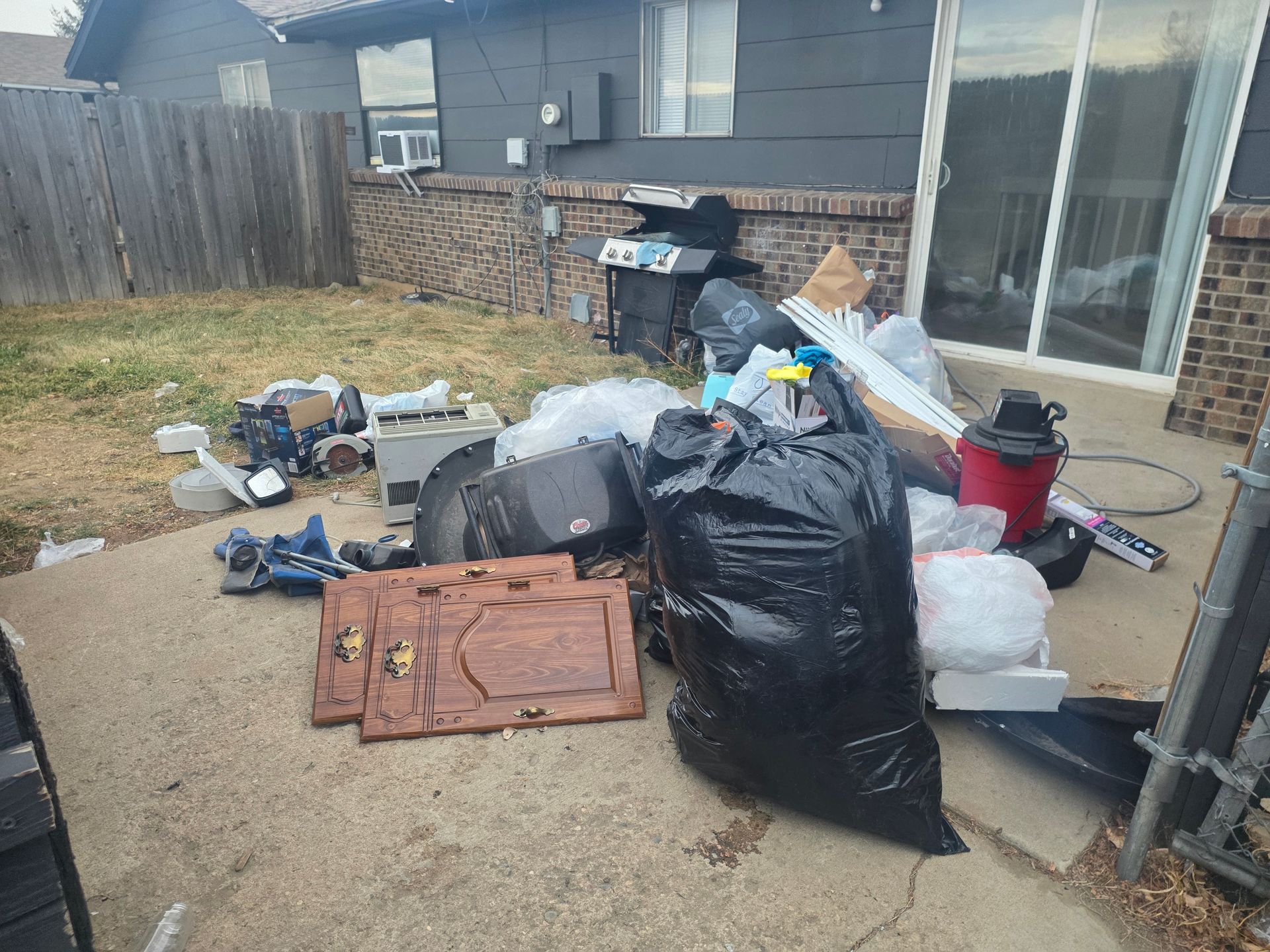 Backyard trash bags pile