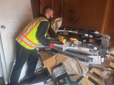 Worker removing furniture items