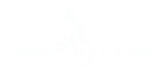 Hair by Vinia Faint white logo of a stylized flame or swirl on a white background