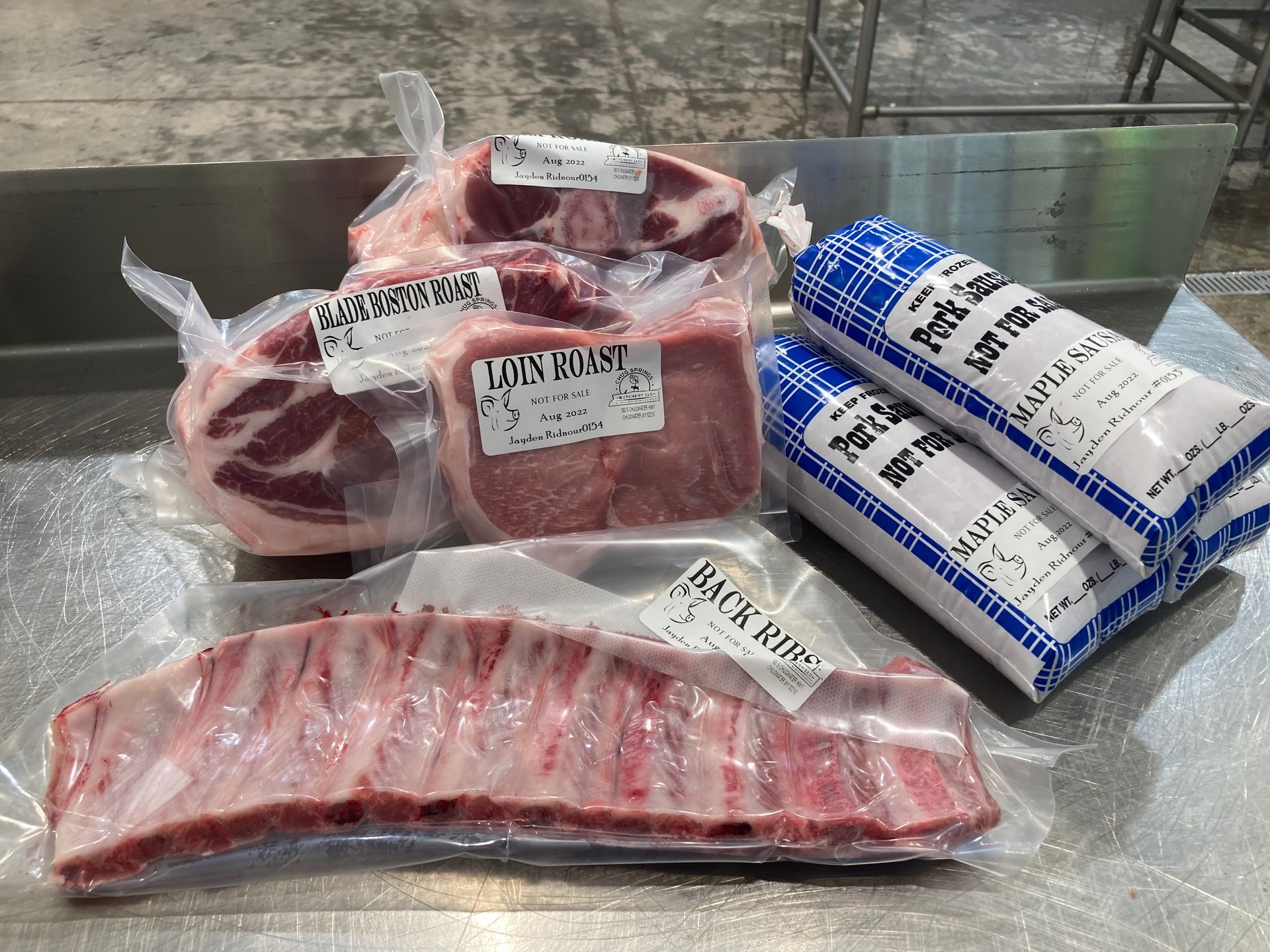 A bunch of meat is sitting on top of a table.