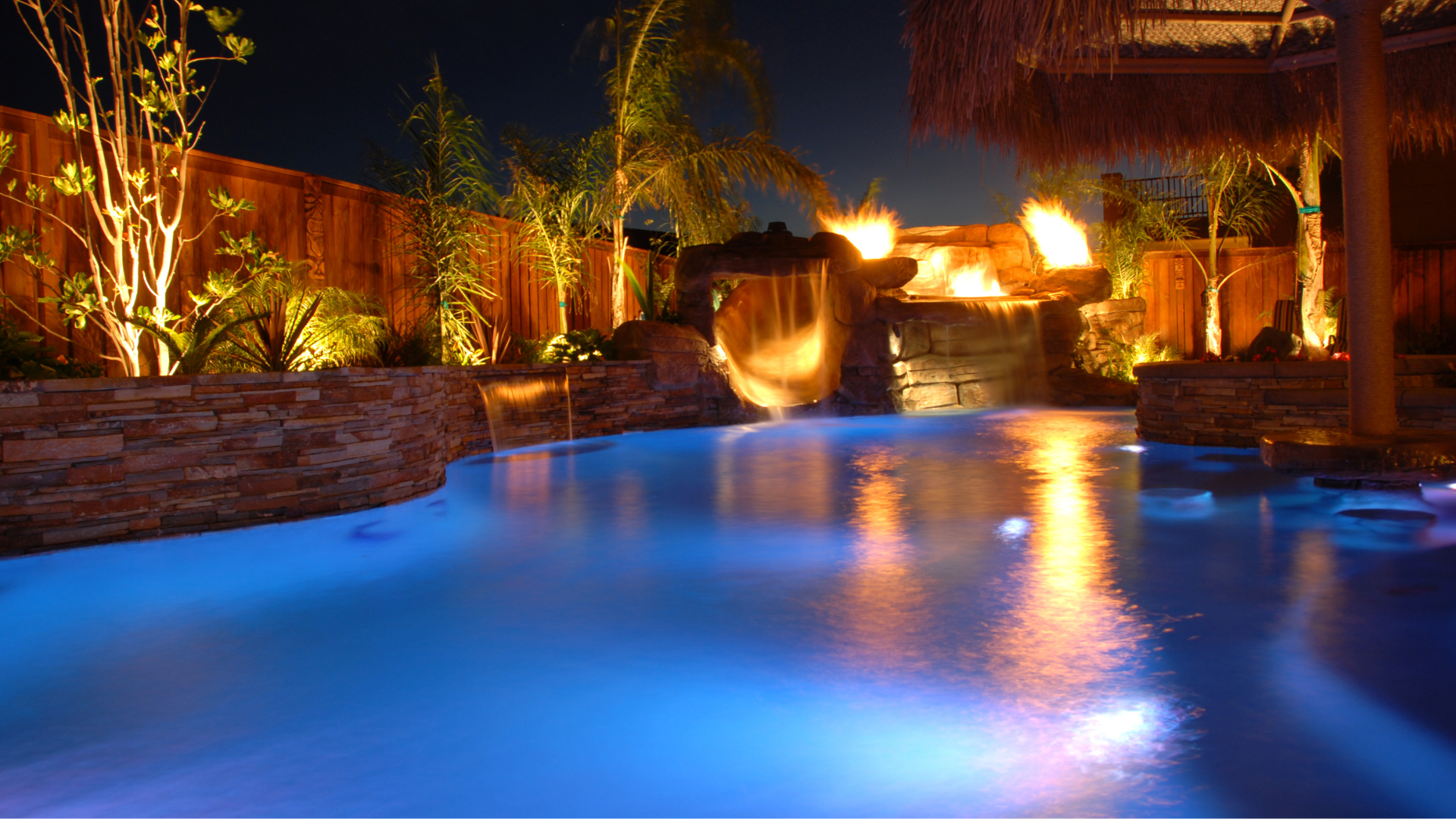 A man is taking a sample of water from a swimming pool.