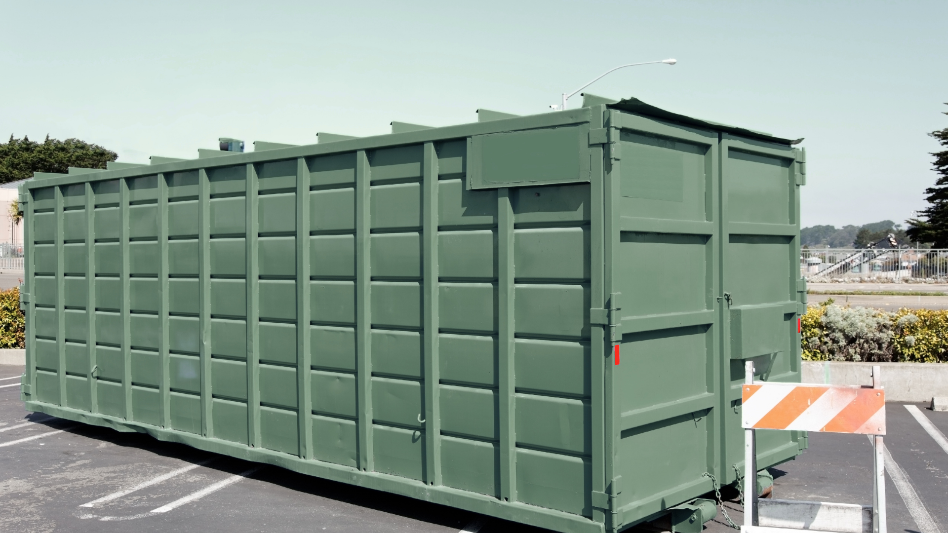 Residential driveway with dumpster for spring cleaning project