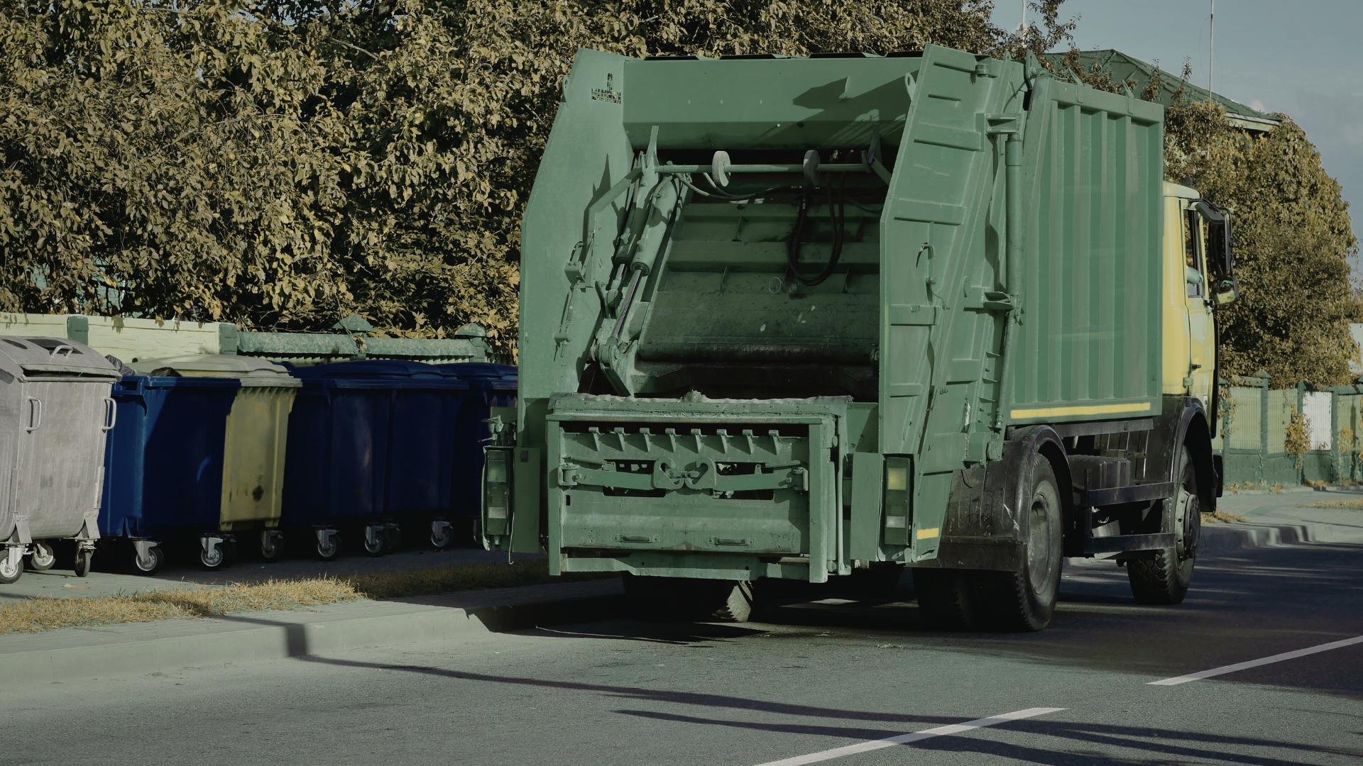 Roll off dumpster being hauled away after completed construction cleanup
