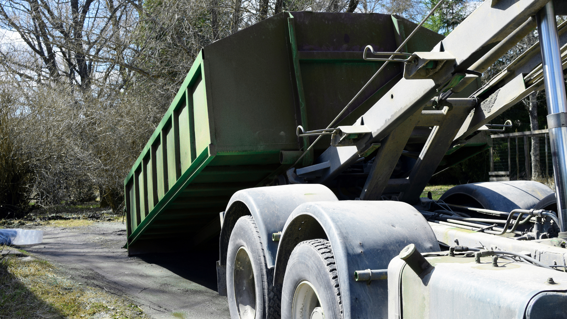 Large roll off dumpster staged for commercial site cleanup work