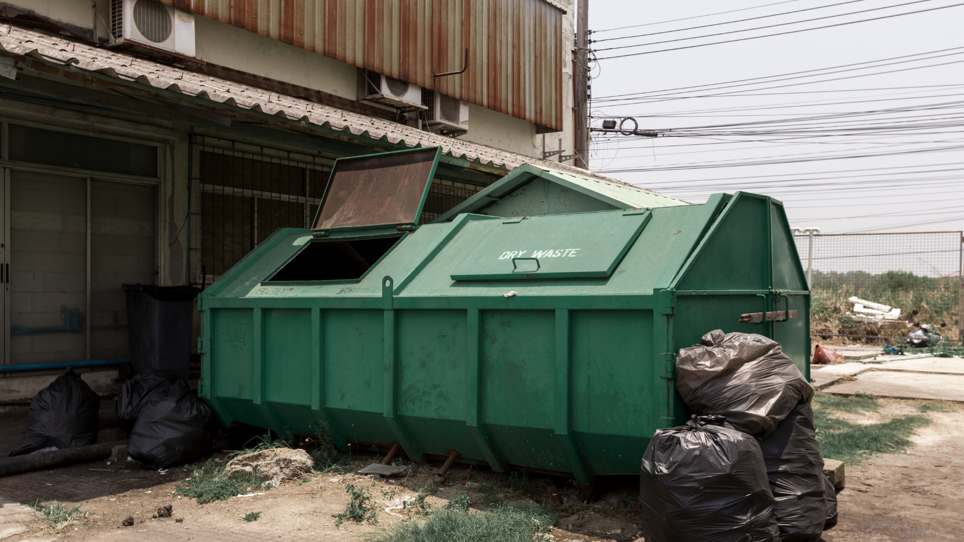 Dumpster delivery truck operating in Goose Creek neighborhood street