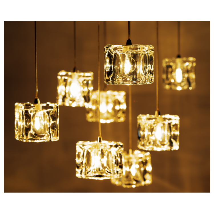 A bunch of lights hanging from the ceiling that look like ice cubes