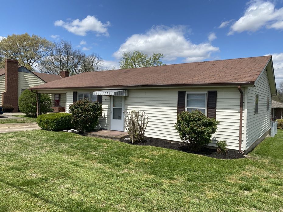 house with green lawn