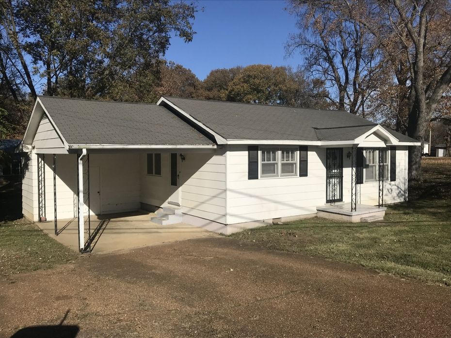 white home with garage cover