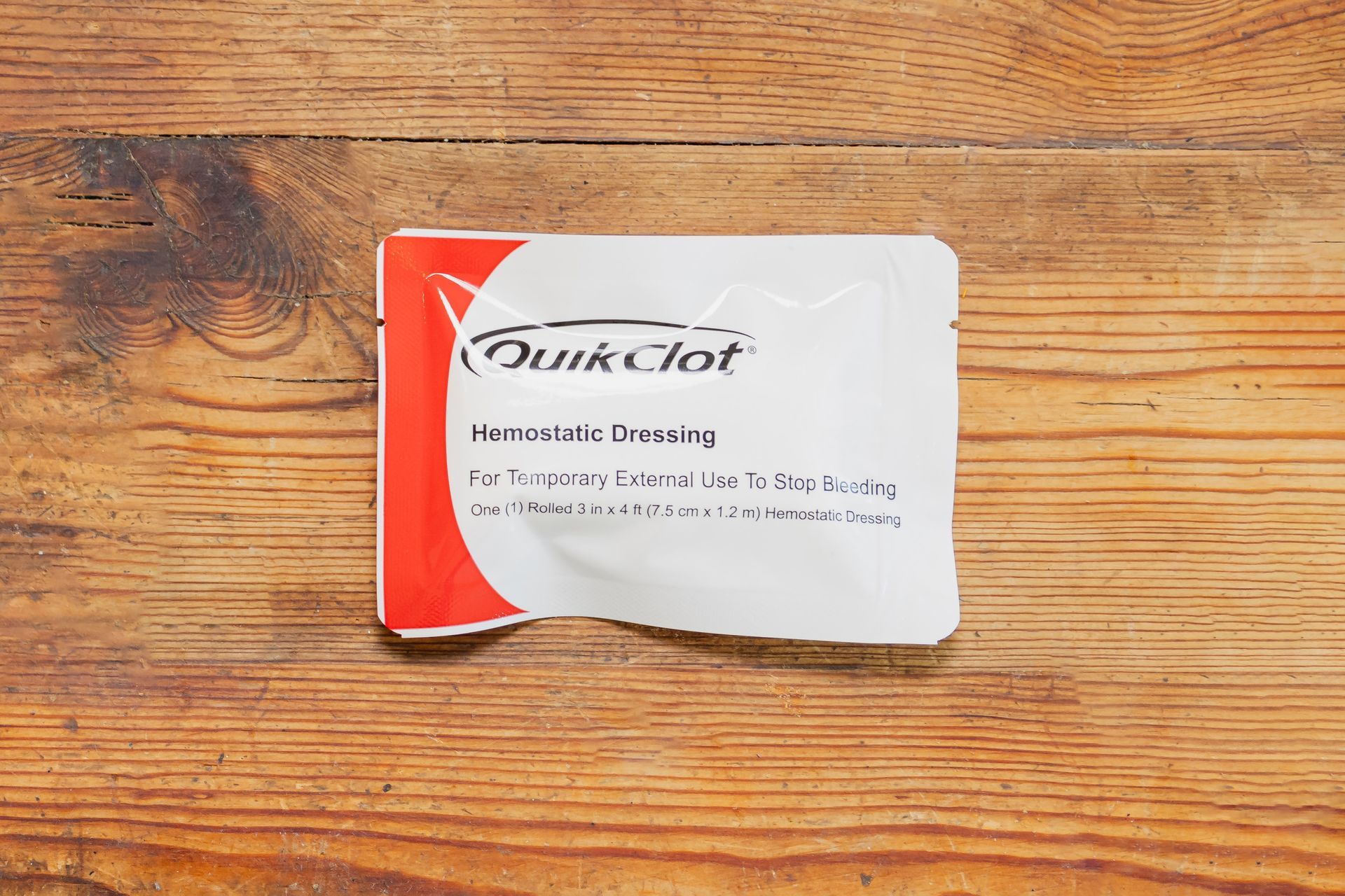 A packet of quick tot is sitting on a wooden table.