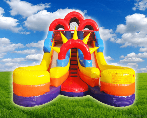 Colorful inflatable obstacle course with red, yellow, and blue slides on grass under a cloudy sky