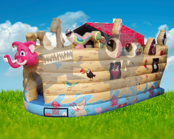 Colorful inflatable pirate ship bounce house on a grassy field under a blue sky