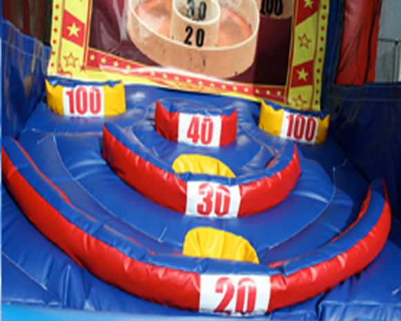 Inflatable carnival target game with red, blue, and yellow rings and numbered scoring zones