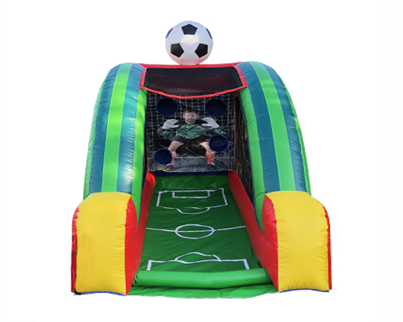 Inflatable soccer goal with ball on top and a green field entrance
