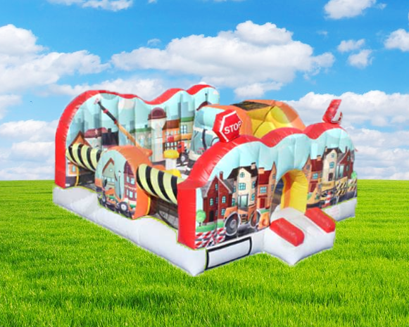 Colorful inflatable bounce house on green grass under a blue sky with clouds