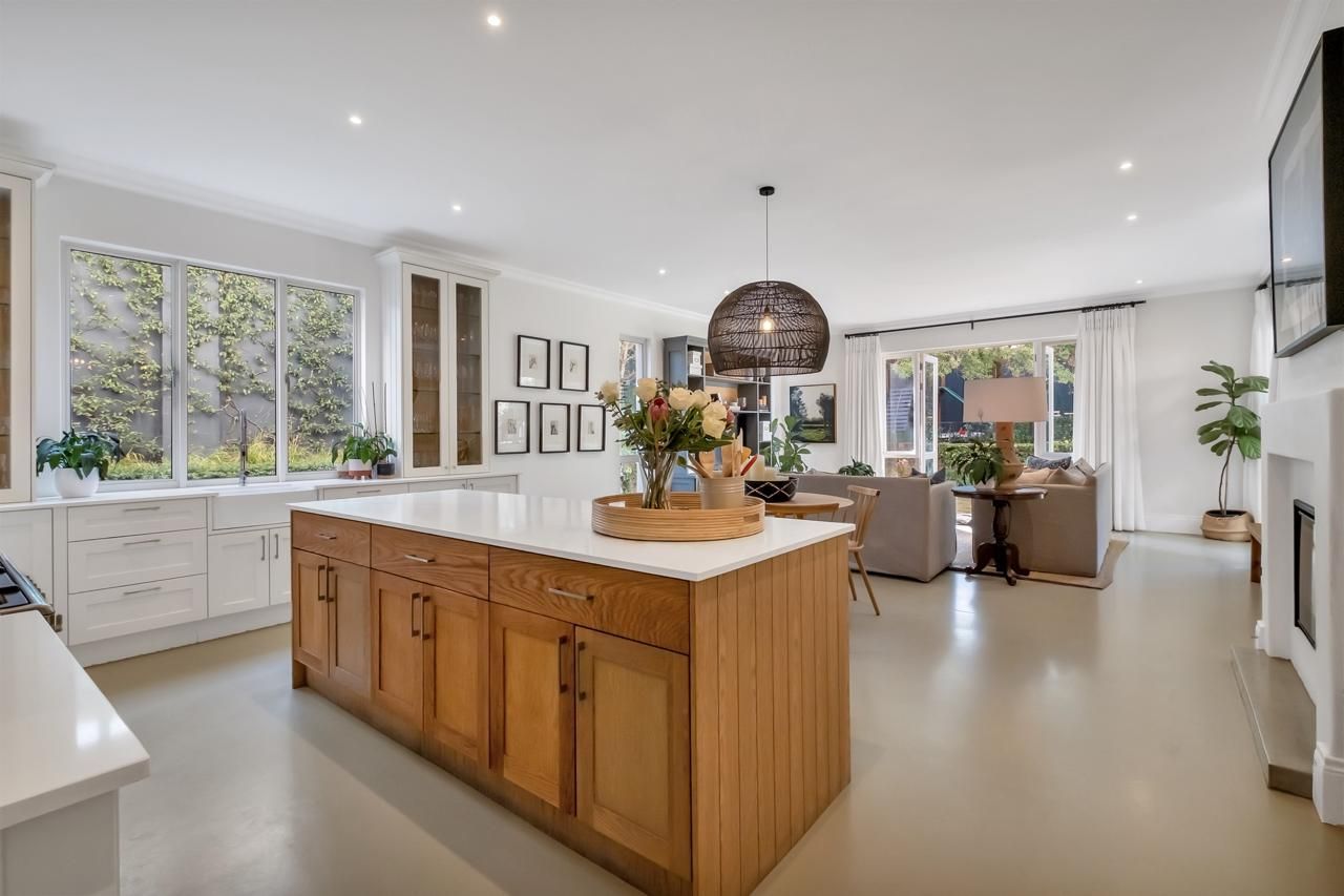 A kitchen with a large island in the middle of the room.