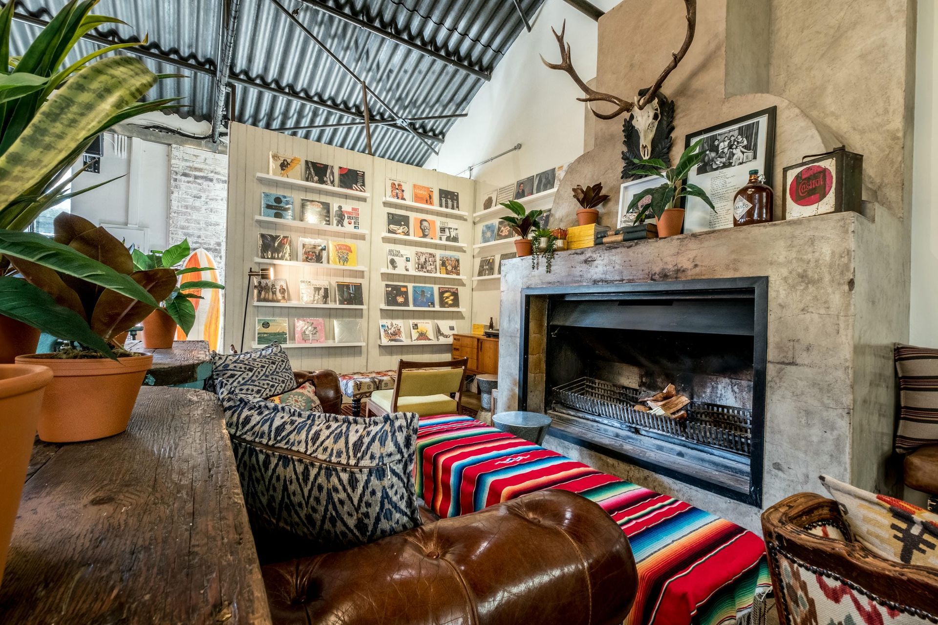 A living room with a fireplace and a couch.
