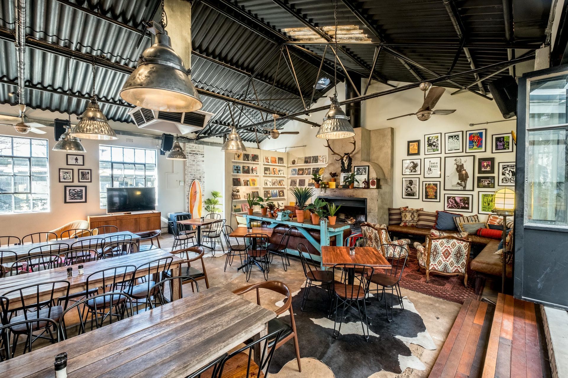 A large room filled with tables and chairs in a restaurant.