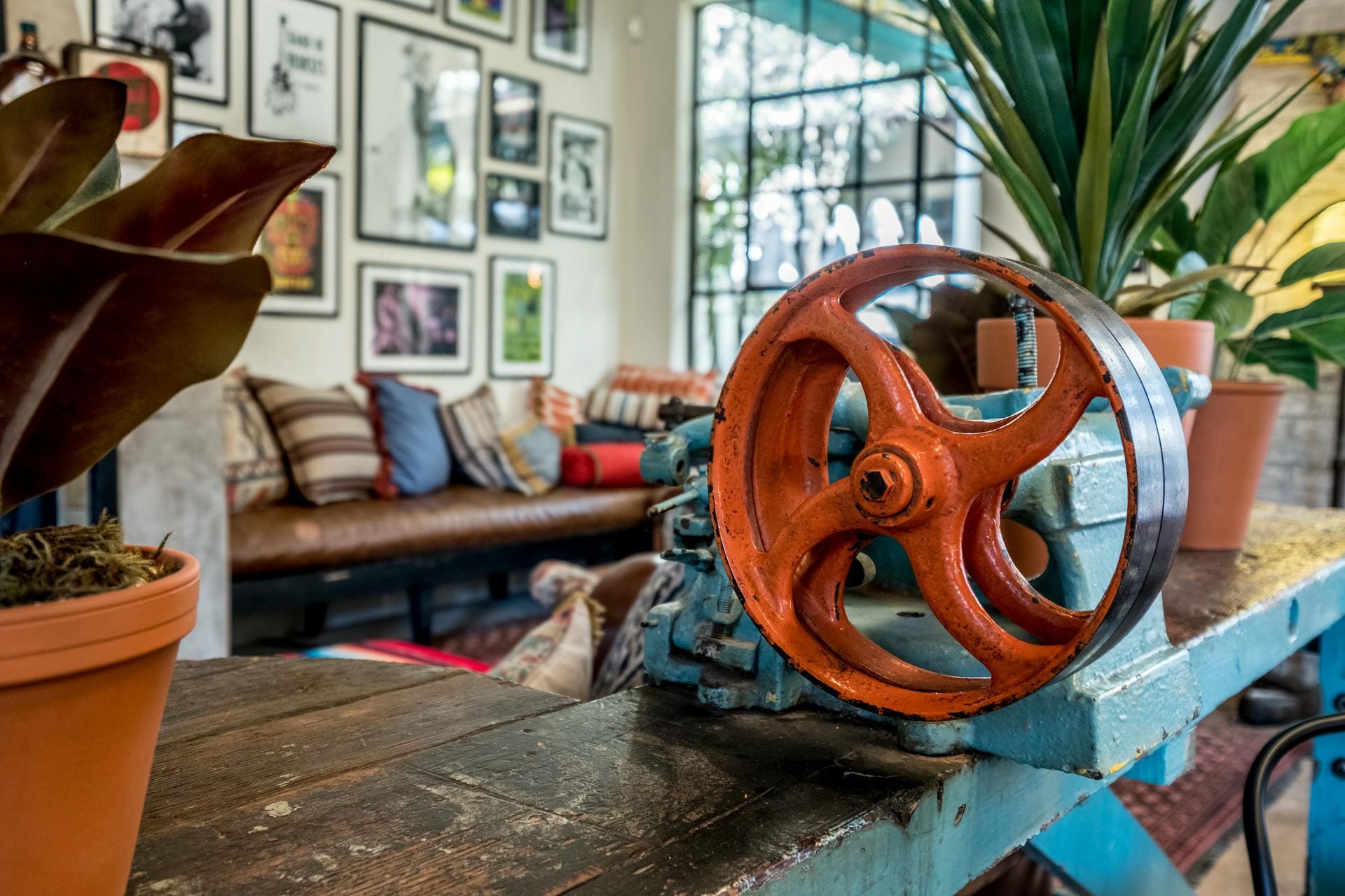 A large wheel is sitting on top of a wooden table in a living room.