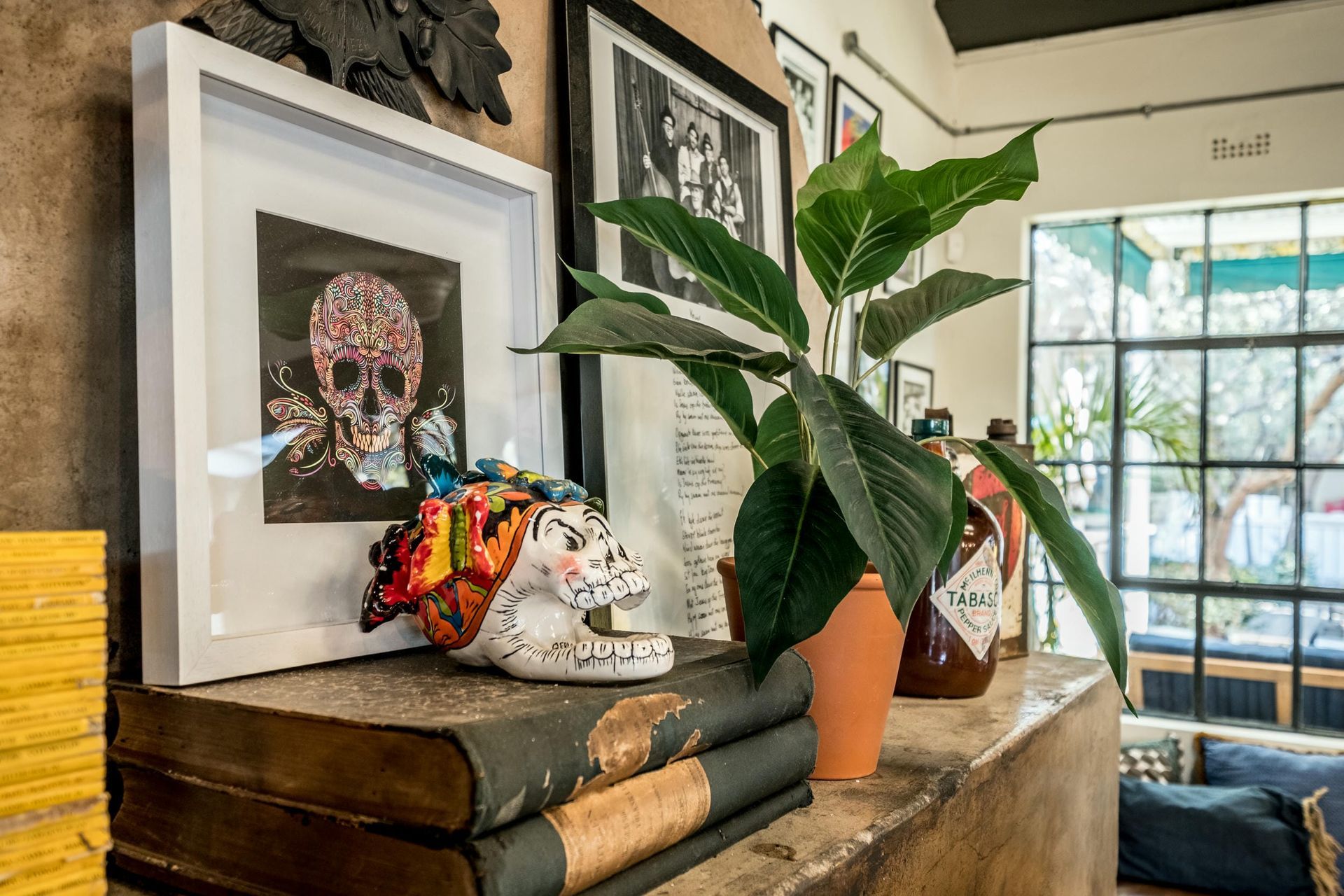 A stack of books with a picture of a skull on top of them.