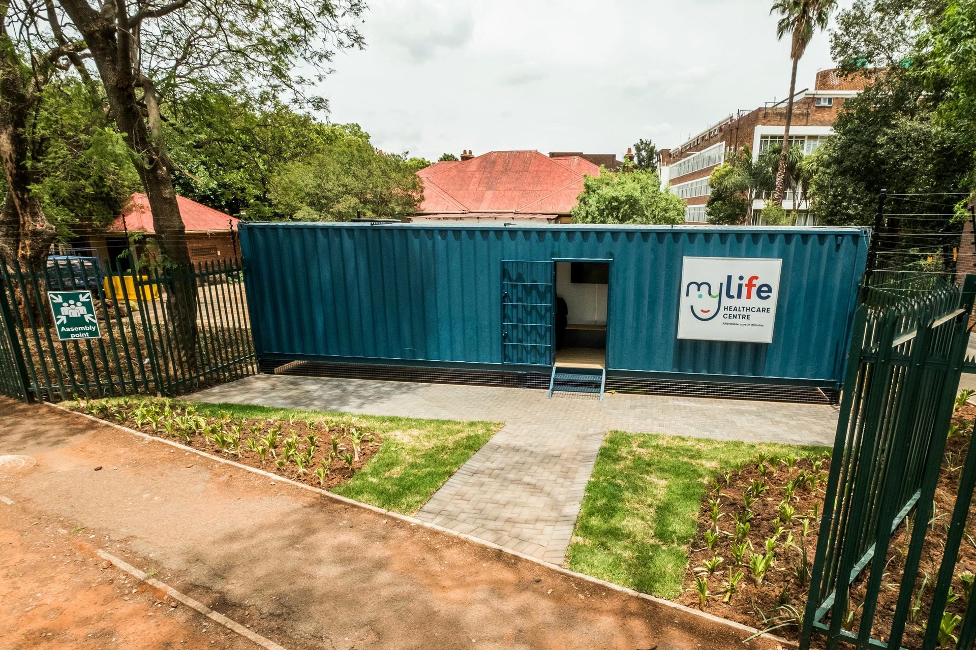 A blue shipping container with a sign that says my life