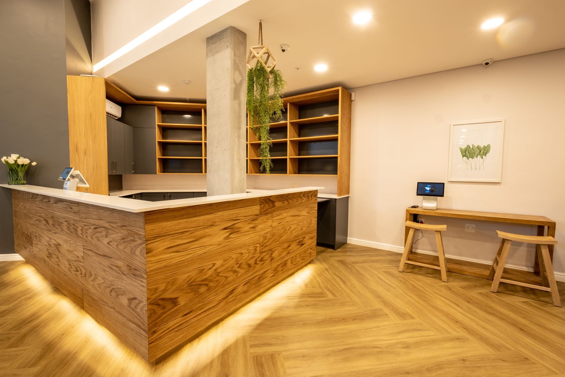 There is a wooden counter in the middle of the room.