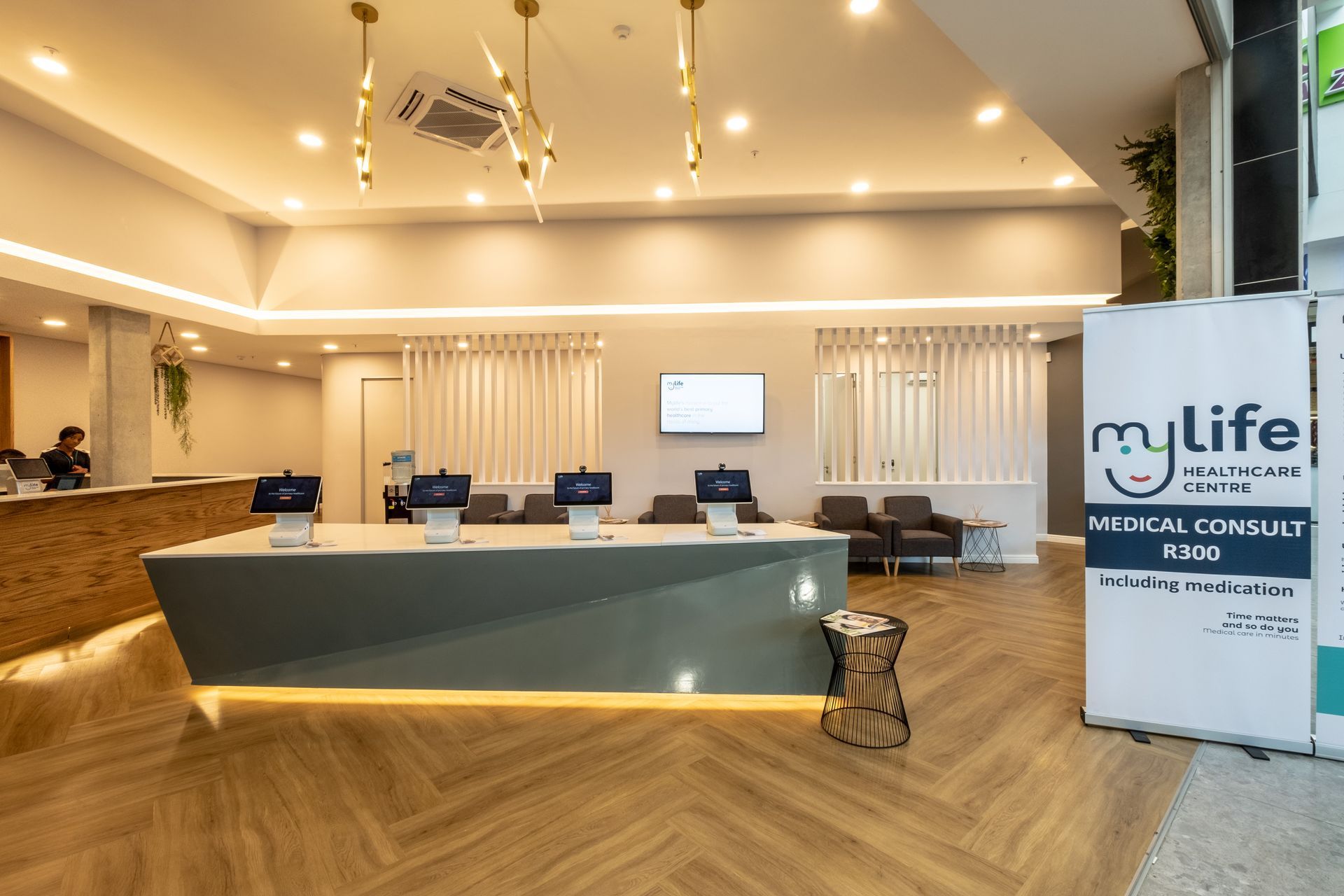 A hospital lobby with a counter and a sign that says `` my life ''.